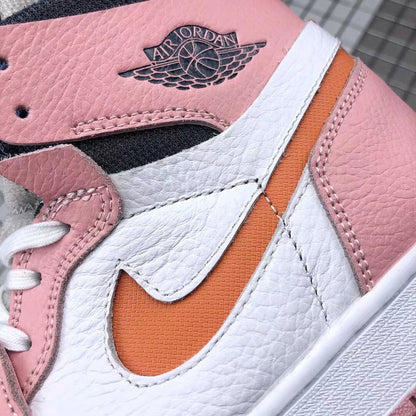 Close-up of the textured pink and white upper, orange side accent, stitching, and Jordan collar branding.