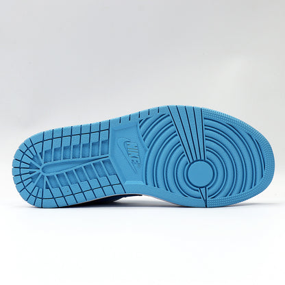 View of the blue rubber outsole with circular and segmented traction patterns.