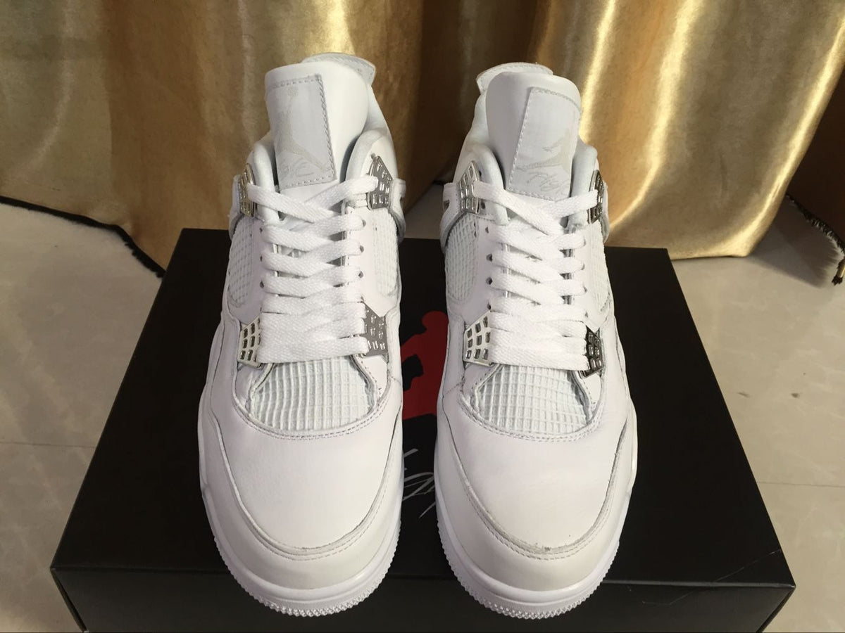 Front view of the pair showing the white toe boxes, laces, tongues, and metallic-look lace wings.