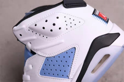 Close-up of the perforated white and University Blue side panels, black trim, and heel cushioning area.