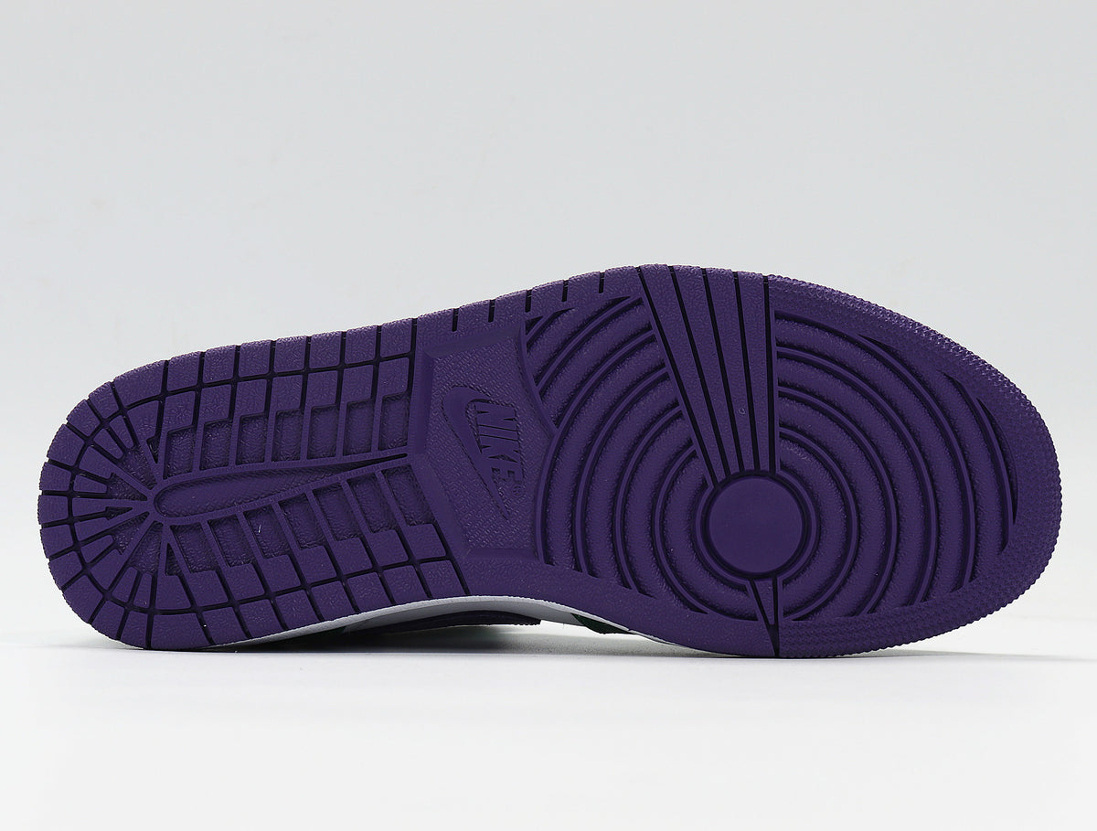 Close-up of a purple rubber outsole with circular traction grooves.