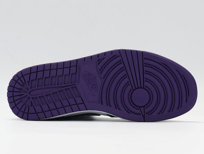 Close-up of a purple rubber outsole with circular traction grooves.