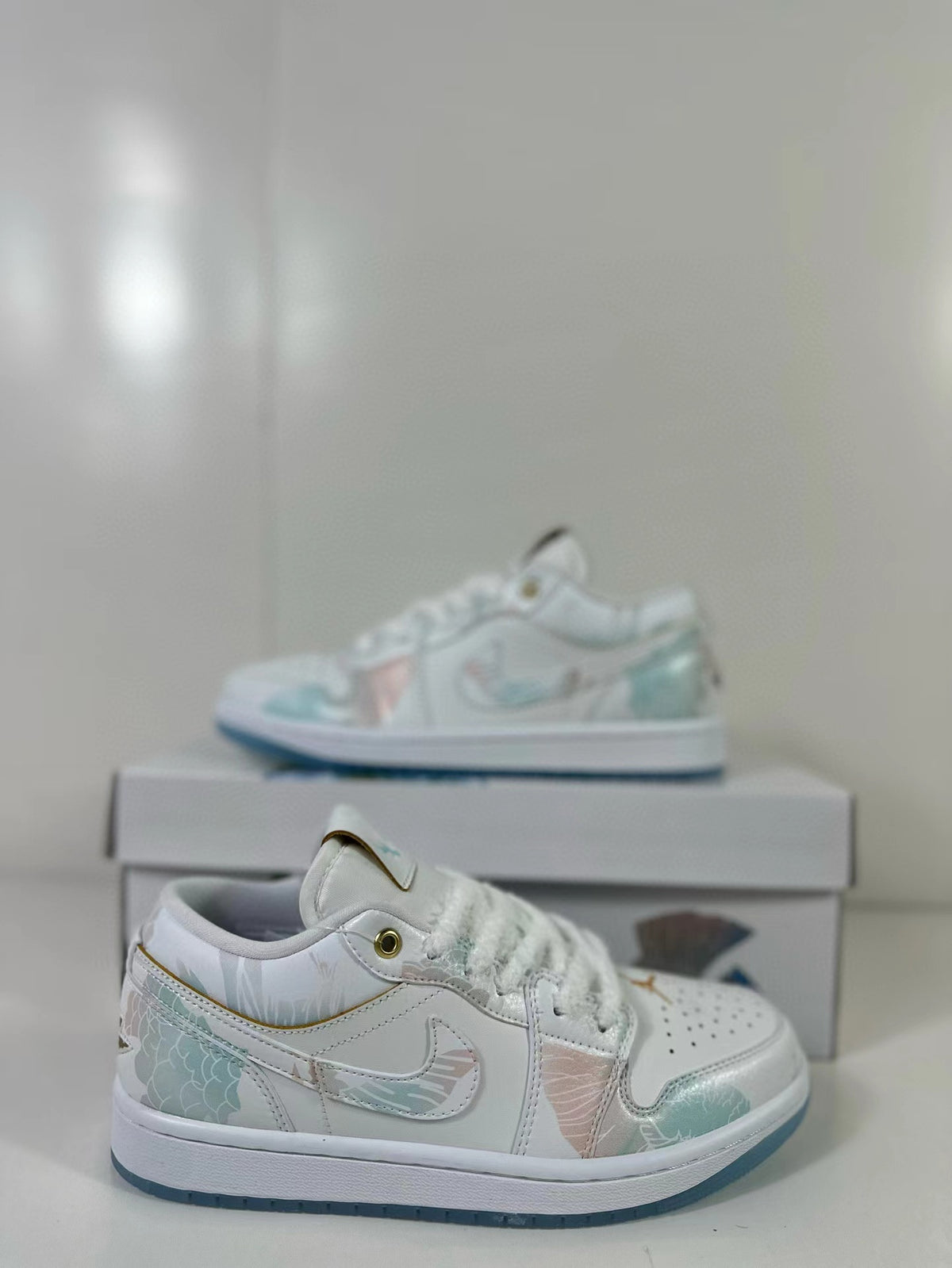Close side view showing the layered upper, lace area, and pastel decorative panels.