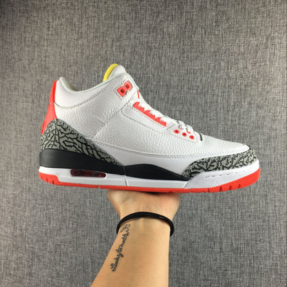 Side view of a white Jordan 3 sneaker with elephant-print overlays and red accents.