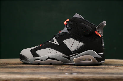 Side profile of a black, grey, and red high-top sneaker with a visible heel air unit.