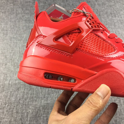 Close-up of the glossy red side panel, stitching, mesh-style insert, and midsole air window.