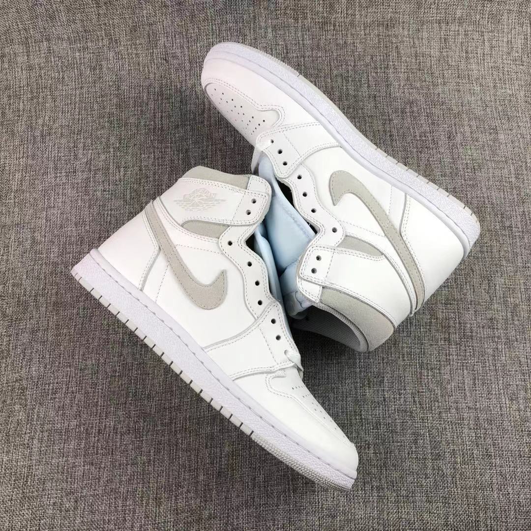 Pair of white and grey high-top sneakers shown from an angled top view.