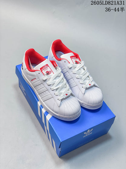 Adidas Superstar White Low-Top Sneakers with Red Accents