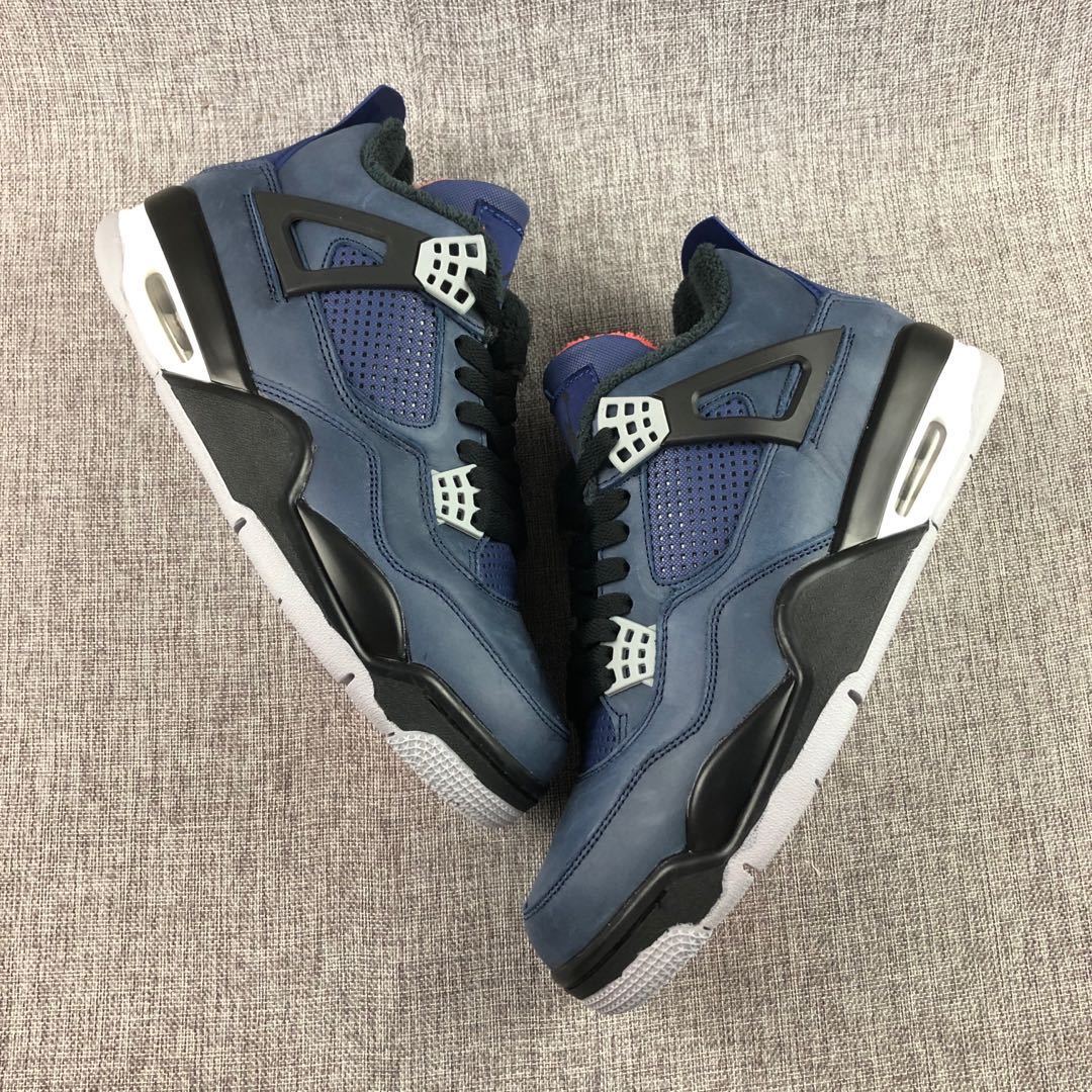 Two dark navy high-top sneakers displayed from above, showing black overlays, mesh panels, and white lace hardware.