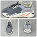 Product collage showing side, top, and rear views of the grey sneakers.