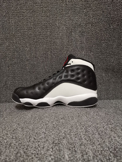 Side profile of the black and white high-top sneaker