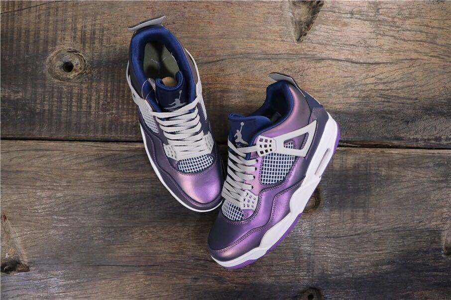 Top view of the blue and purple Jordan sneakers with white laces, mesh panels, and white midsoles.