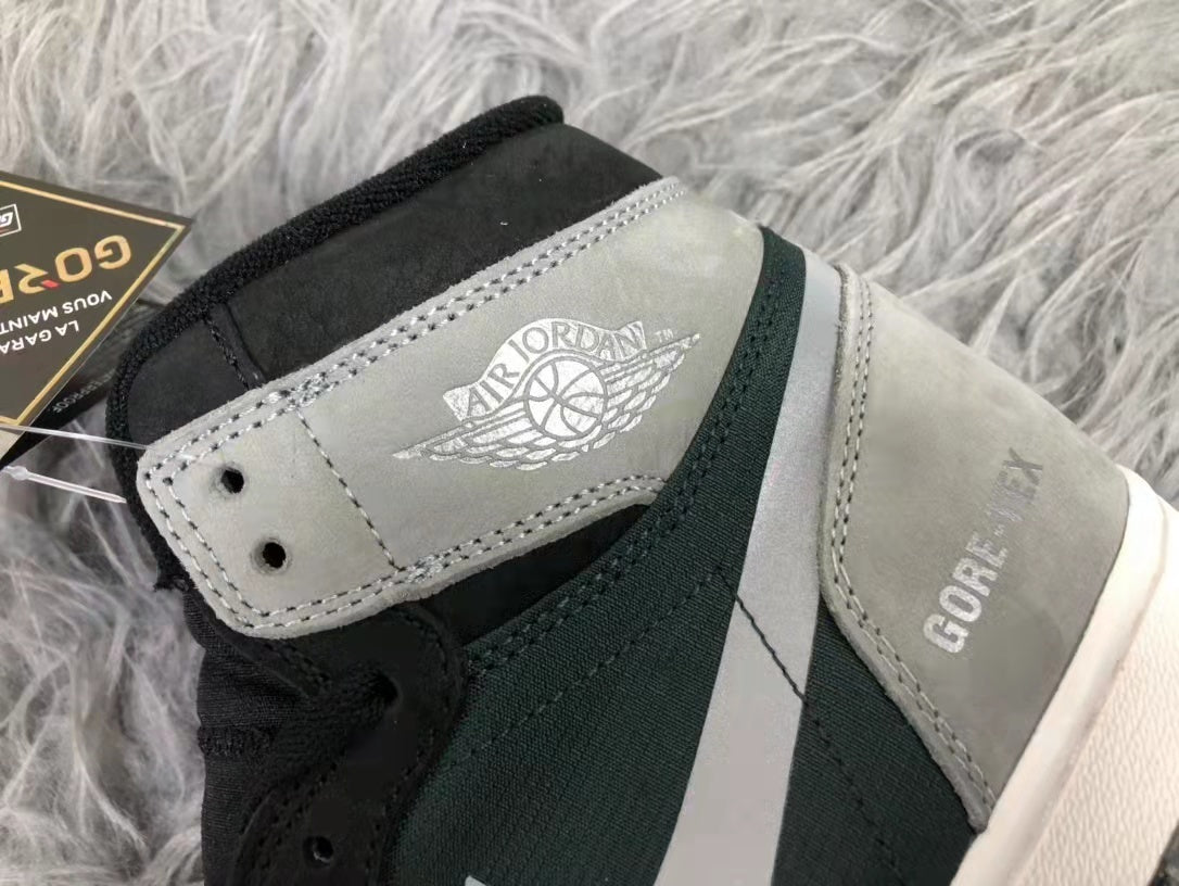 Close-up of the grey ankle panel showing Jordan Wings branding and Gore-Tex lettering on the side.
