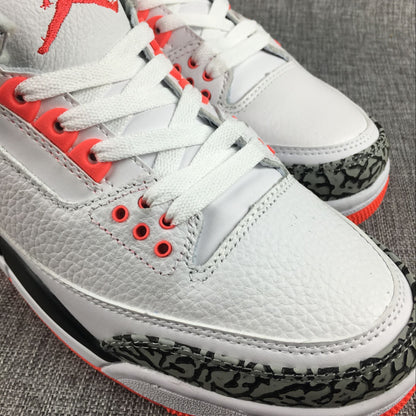 Close-up of the white laces, red eyelets, and elephant-print toe overlay.