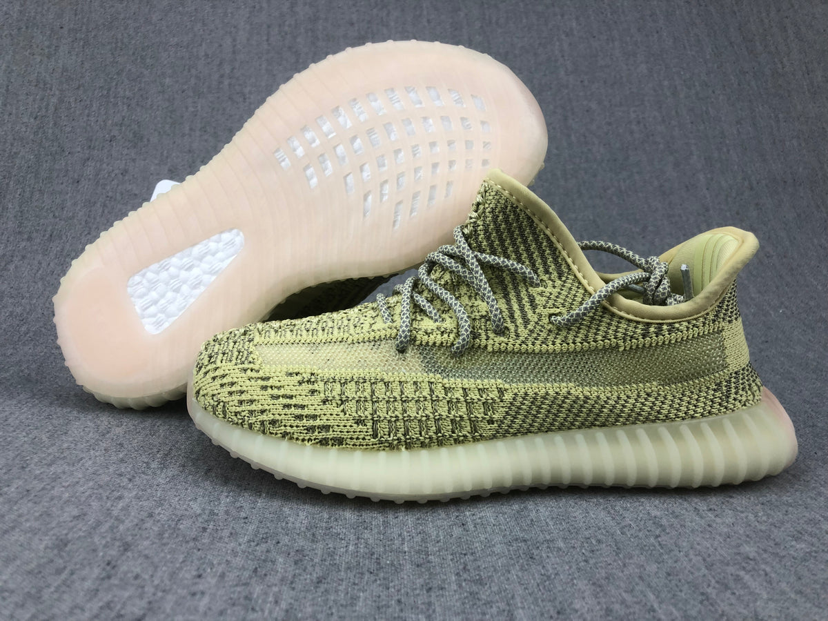 Pair of sneakers showing the patterned upper and translucent ribbed outsole.