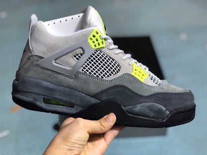 Side profile of the grey, black, and bright green high-top sneaker with a visible heel air window.