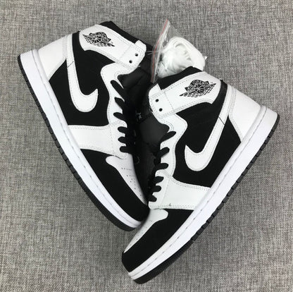 Overhead view of the black-and-white high-top sneaker pair