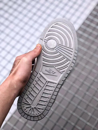 Bottom view of the sneaker showing the circular traction pattern and molded outsole branding.