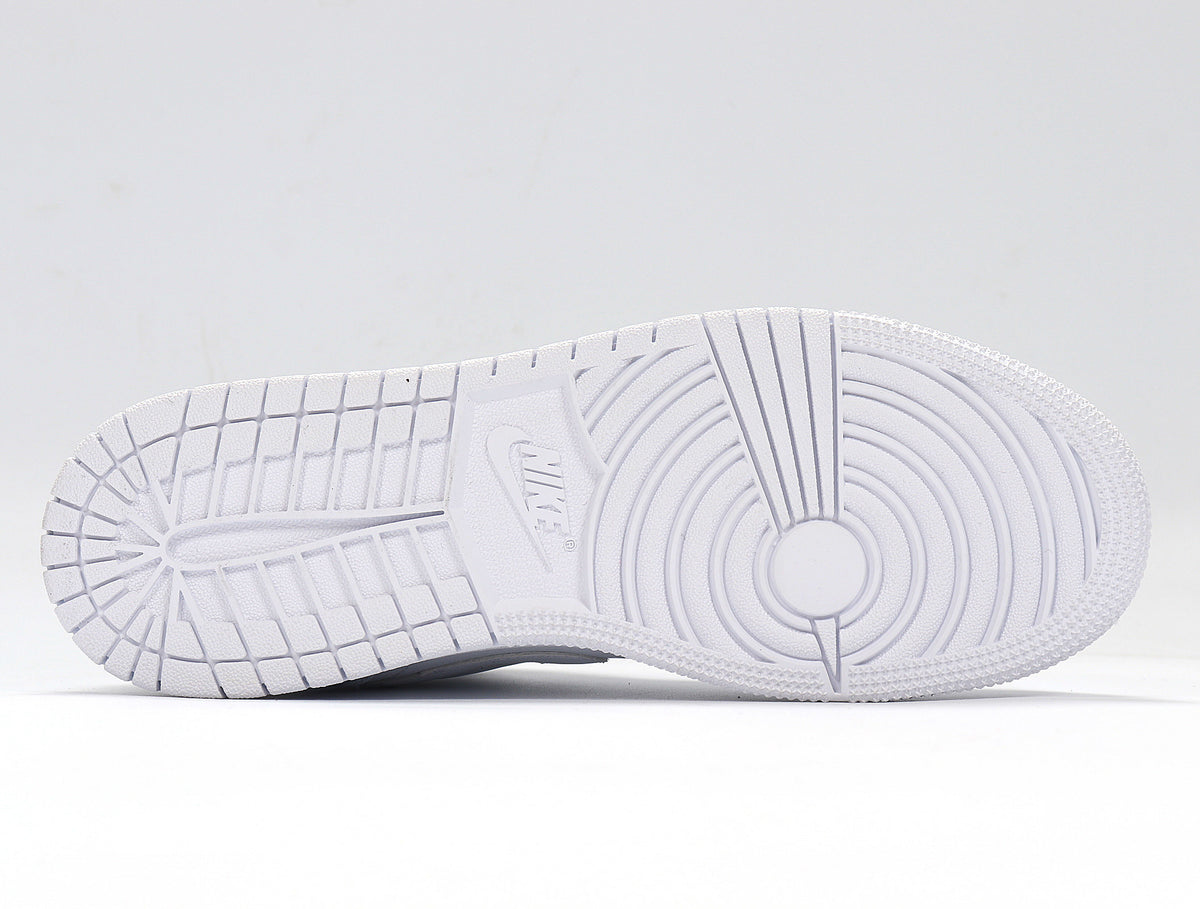 Underside view showing the white textured rubber outsole with circular and block tread patterns.
