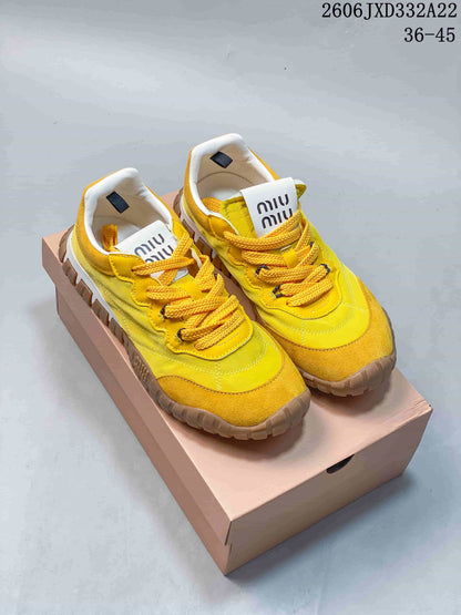 Miu Miu Tyre Low-Top Sneakers in Yellow