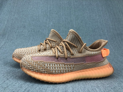 Pair of brown and beige low-top sneakers shown from an angled side view.