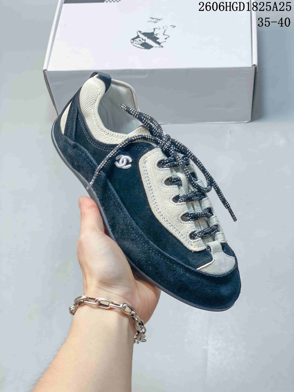 Chanel Two-Tone Low-Top Trainer in Black and Ivory