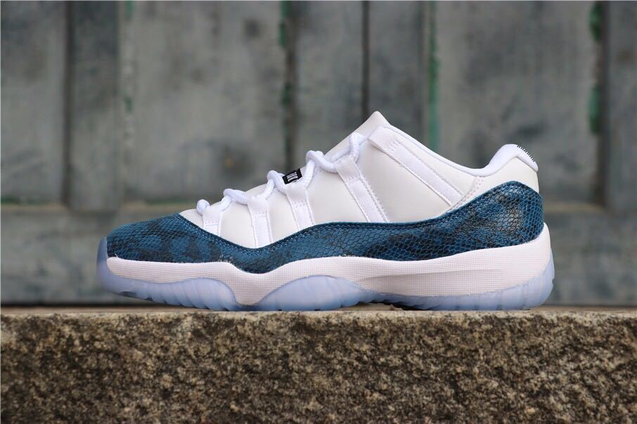 Single side view highlighting the navy patterned panels and white upper.