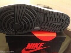 Underside view showing the circular traction pattern on the black outsole.