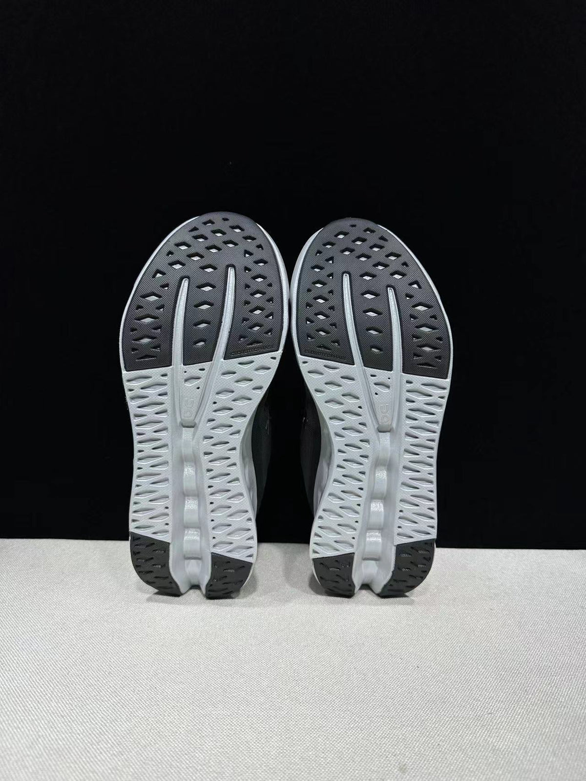 On Cloudsurfer Running Shoes in Black and Glacier