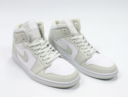 Three-quarter view of the light Spruce and white high-top sneaker pair.