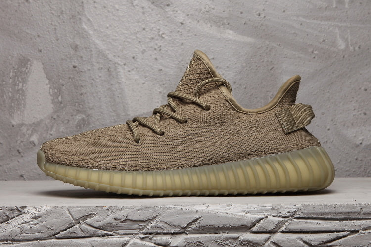 Side profile highlighting the low-top silhouette, heel pull tab and ribbed outsole.