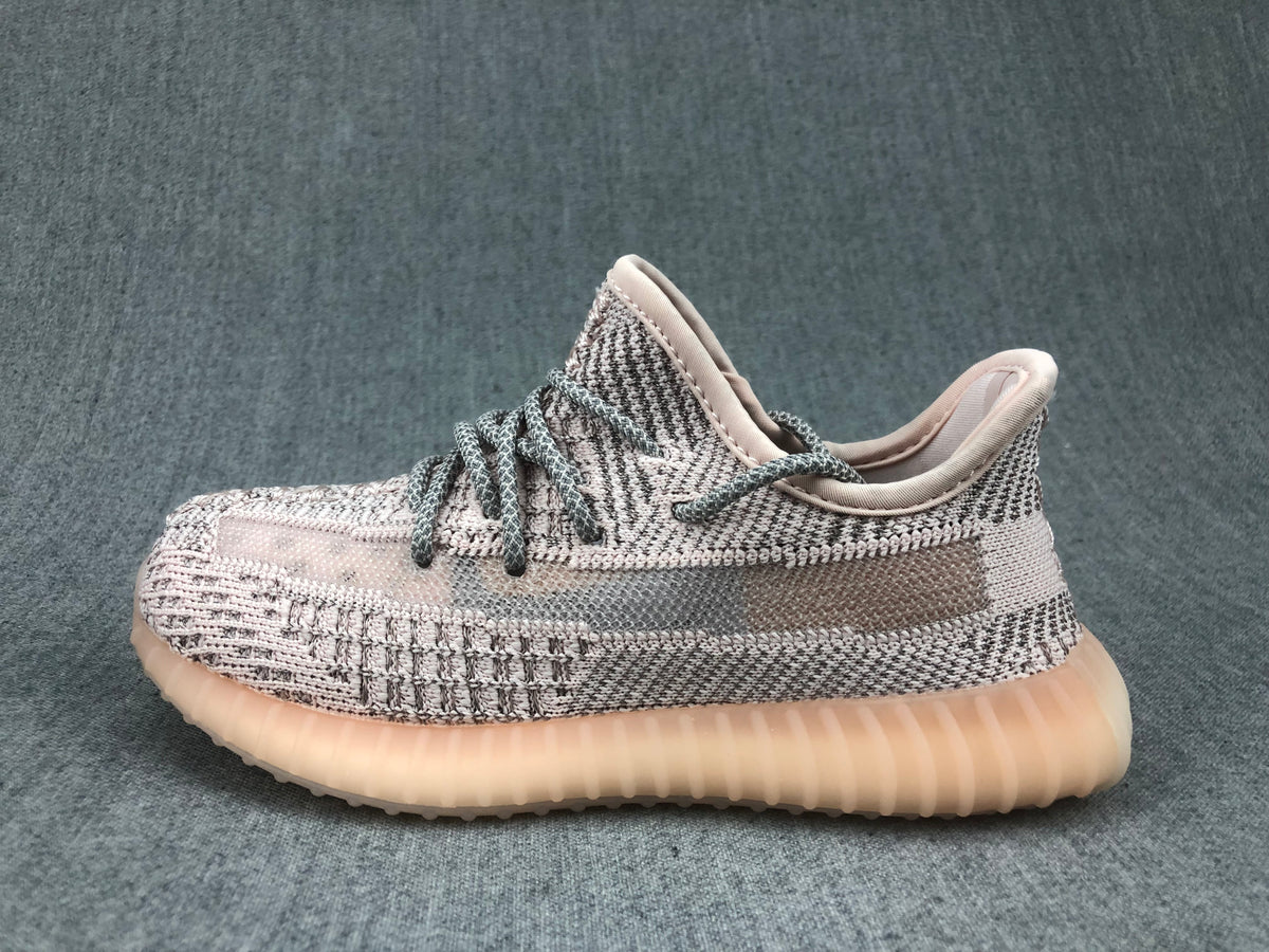 Side profile showing the knit-style upper, translucent side stripe, and ribbed sole.