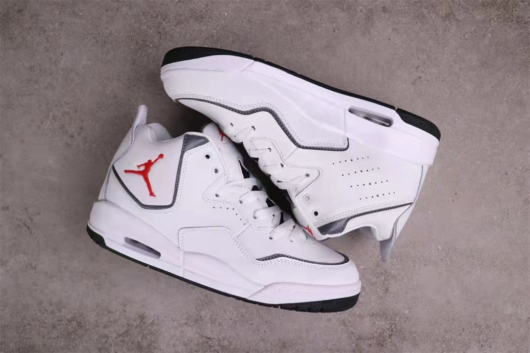Pair of white and black sneakers shown from an angled overhead view