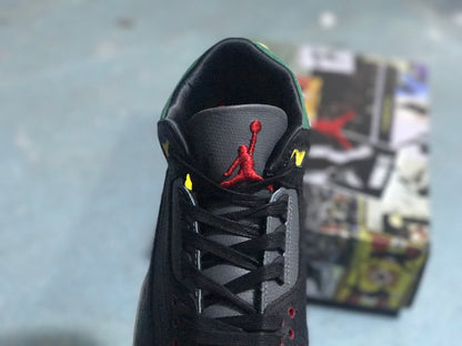 Front view of the sneaker showing black laces and a red Jumpman-style tongue emblem.
