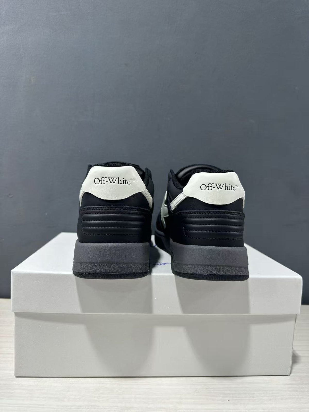 Rear view showing white heel panels, Off-White branding, and padded heel sections.