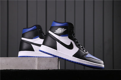 Black, white and blue high-top sneakers displayed on a raised surface.