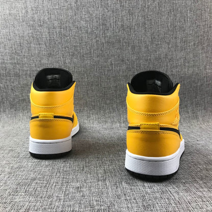 Rear view of both sneakers showing the yellow heels and black collar lining.