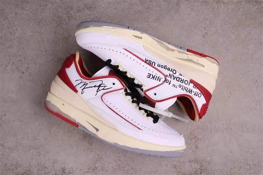 Overhead view of the pair showing layered white panels, red heel sections, and side printing.