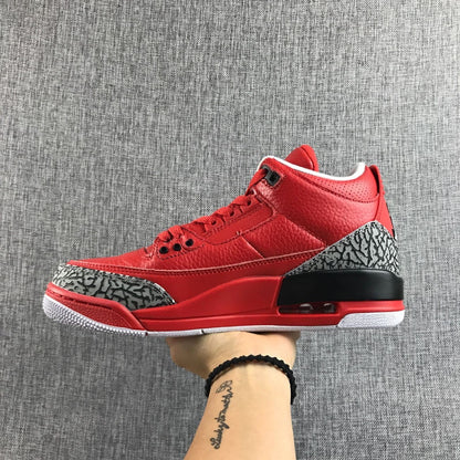 Side profile of the red sneaker with black heel accent and visible heel unit.