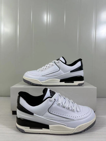 Three-quarter product view showing the white and black colorway and layered sole construction.