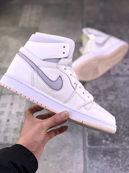 Side profile of the pearl white high-top sneaker showing the gray side accent, layered panels, and lace-up design.