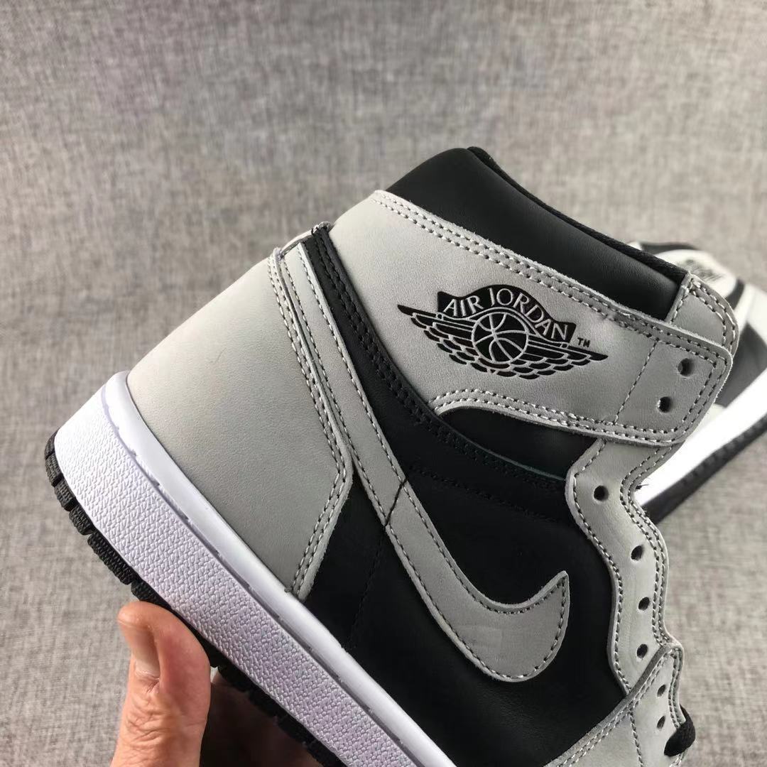Close-up of the grey side overlay, black side panel, and Air Jordan wing branding.