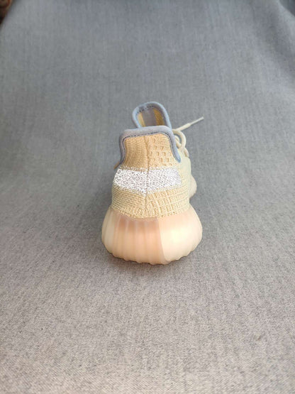 Rear view showing the padded collar, heel construction, and translucent outsole.