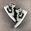 Pair of black and grey high-top sneakers shown from an overhead angle.