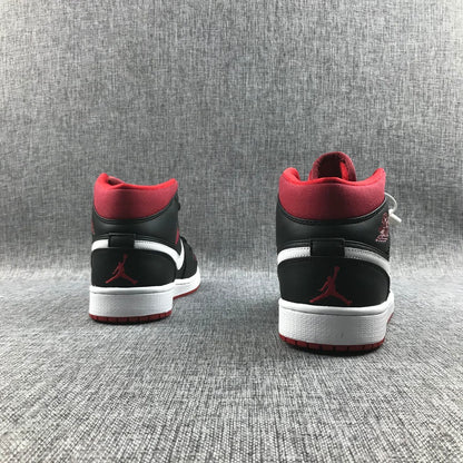 Rear view of the pair showing red collars, black heel panels, white accents, and red Jumpman details.