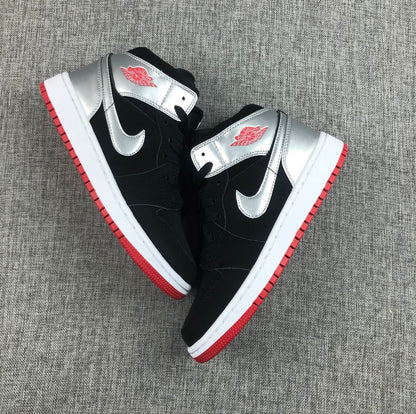 Top-down view of the pair highlighting the silver overlays, black uppers and red outsoles.
