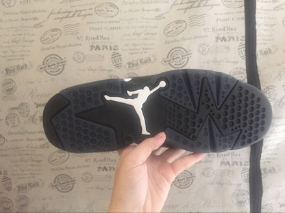 Close view of the black rubber outsole showing circular traction details and a contrasting Jordan logo.