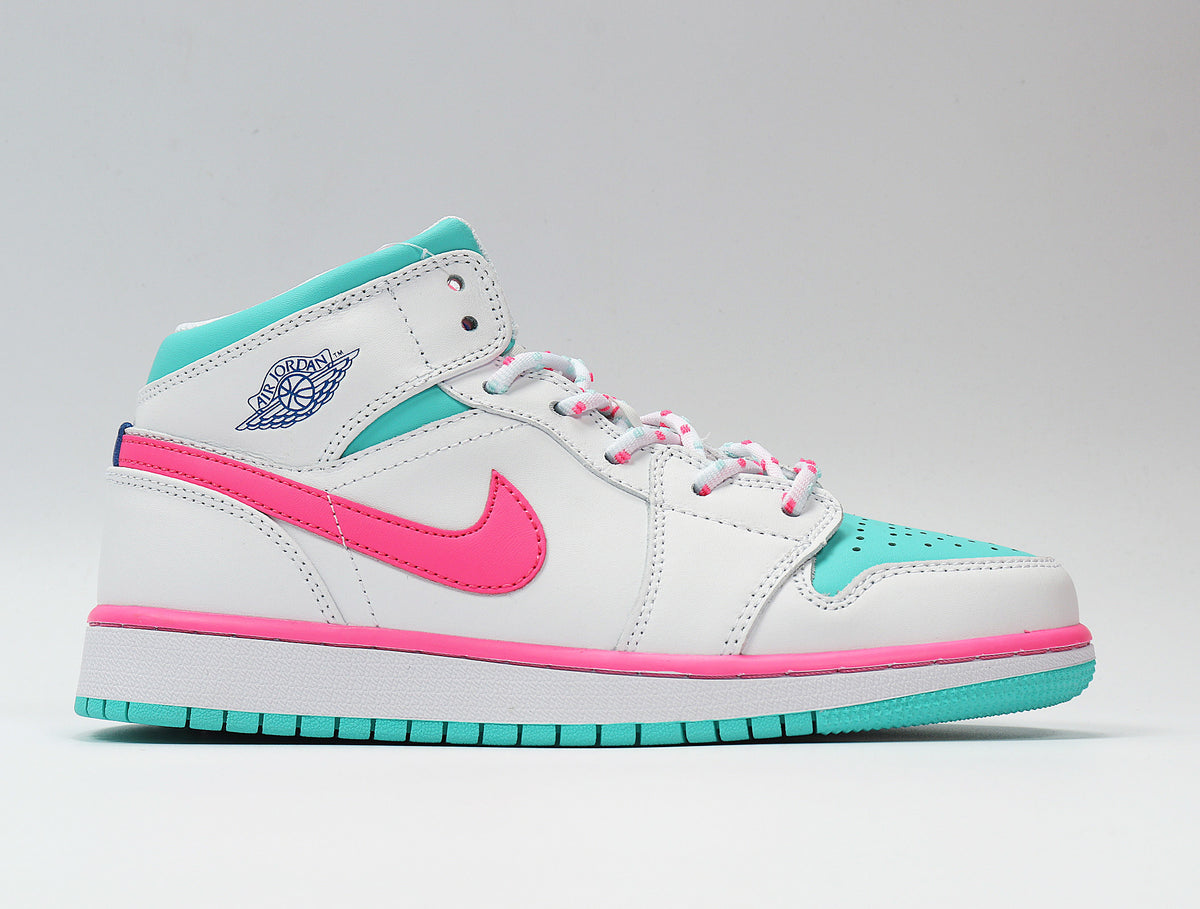 Opposite side profile showing Jordan wing branding, pink Swoosh detailing, and aqua outsole accents.