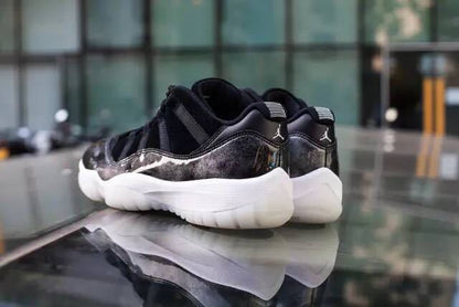 Rear lifestyle view of the pair on a reflective surface, showing the heel panels and translucent outsole.