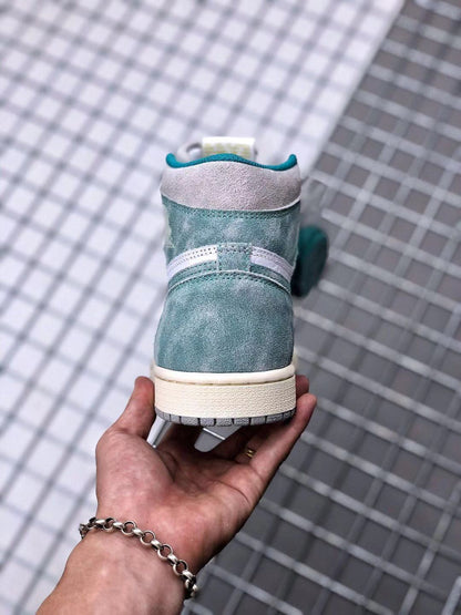 Rear view of the high-top sneaker showing the teal-green heel, light grey collar, and cream-colored midsole.